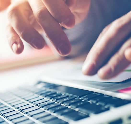 a person typing on a computer