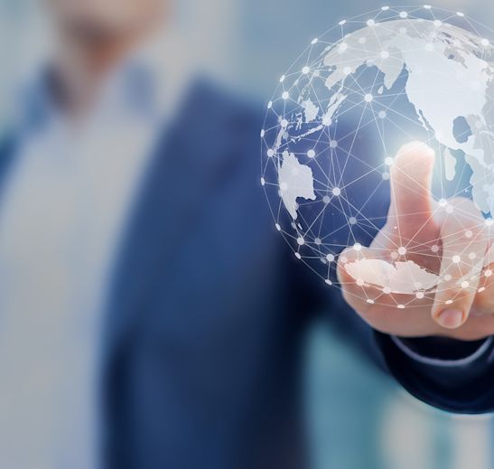hand touching a holographic globe