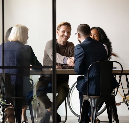 a group of professionals sitting together and discussing something