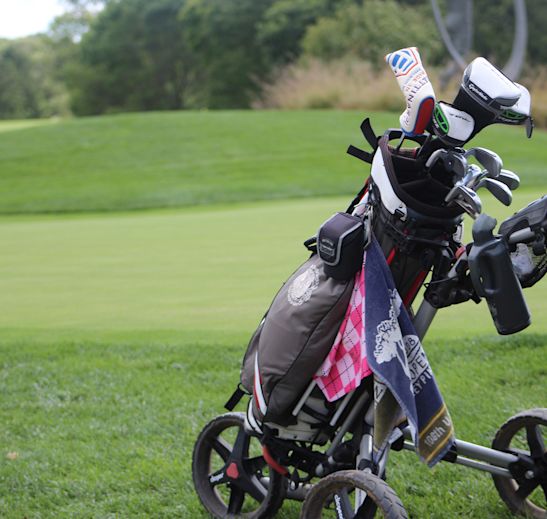 a set of golf clubs on a golf course