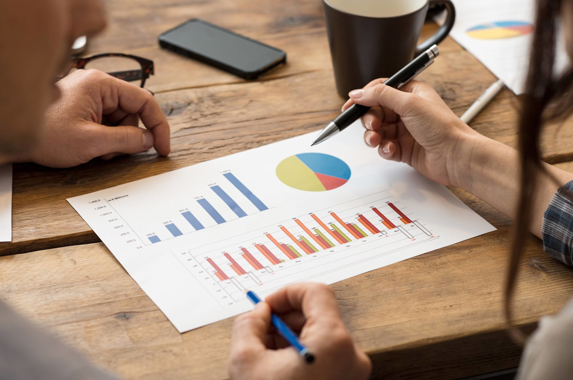 two people looking at a chart