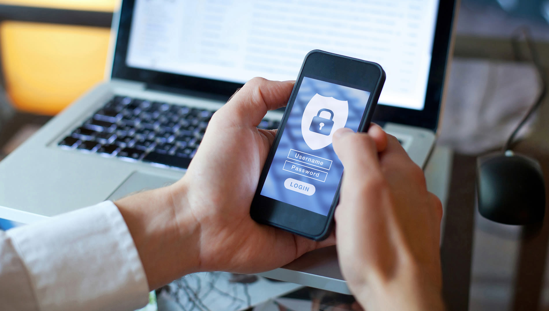 individual looking at a login screen on cell phone