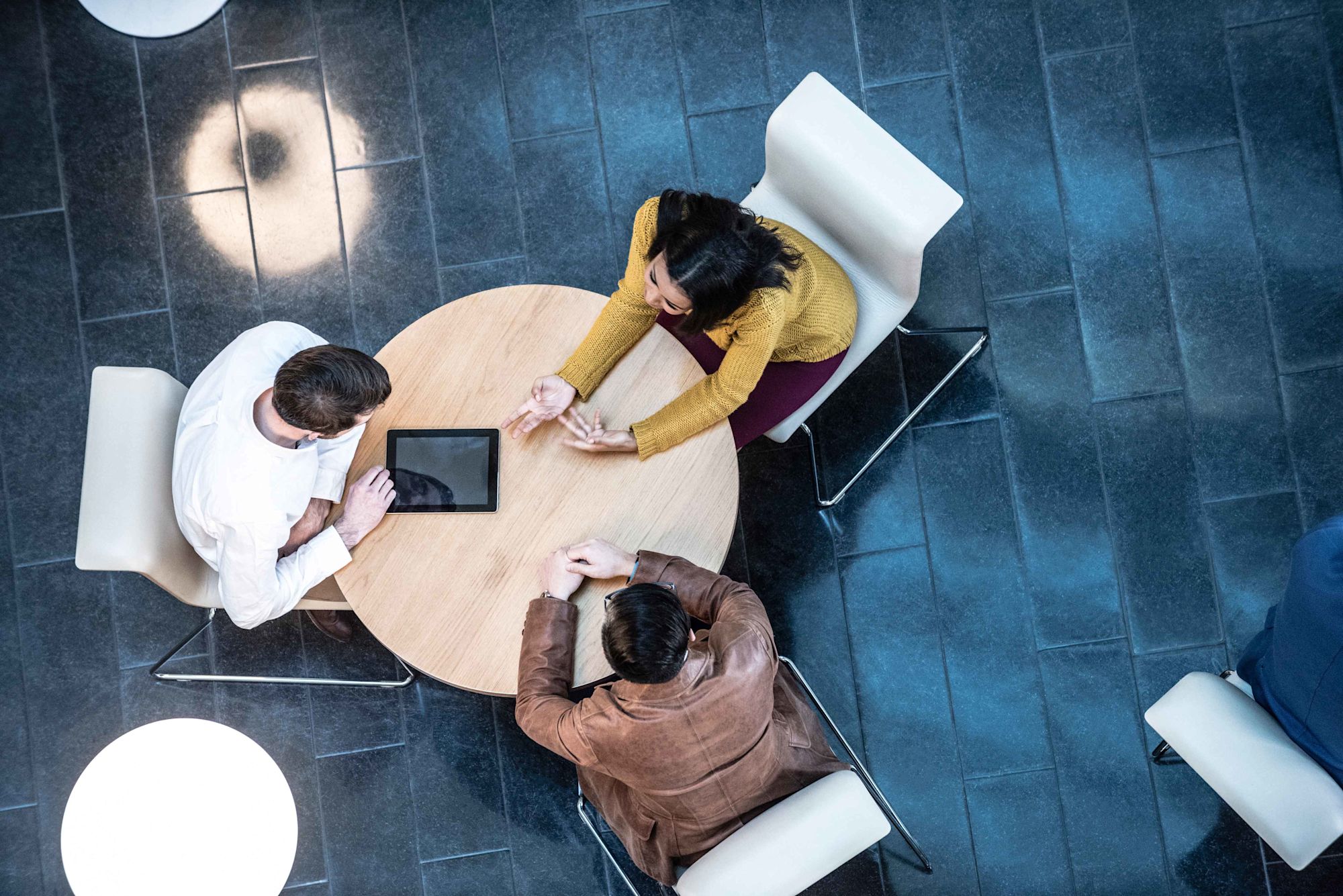 business meeting three people aerial view istock 000079007561 double2