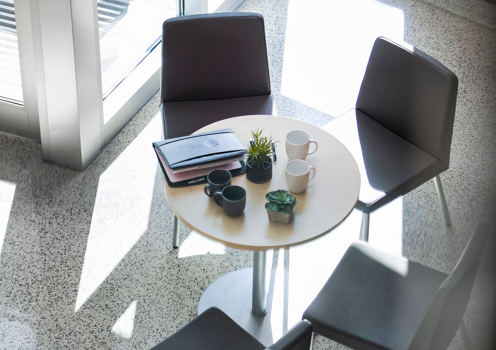 a business lobby showing a table that has documents on it