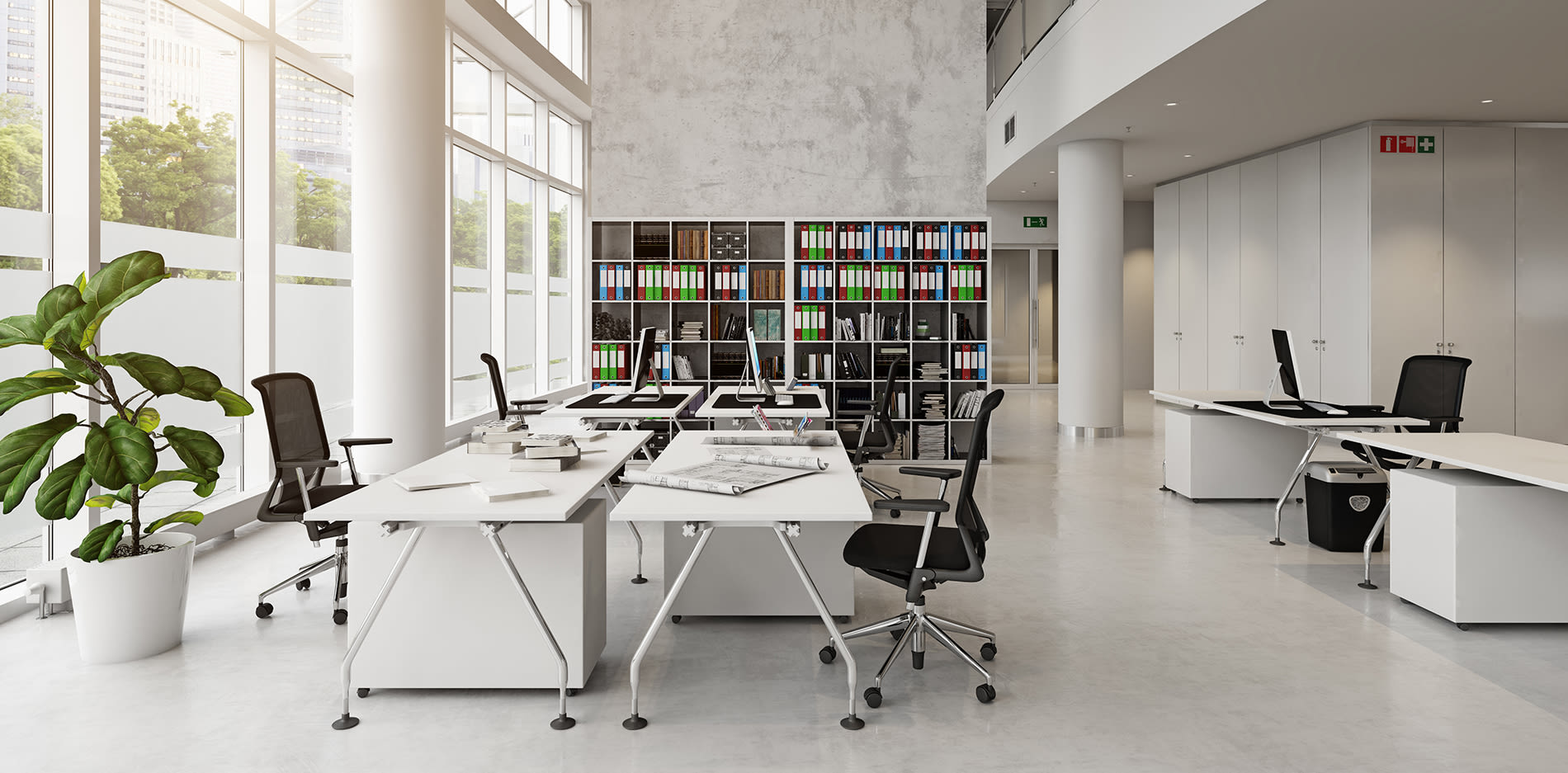 a large white room with a desk in the middle