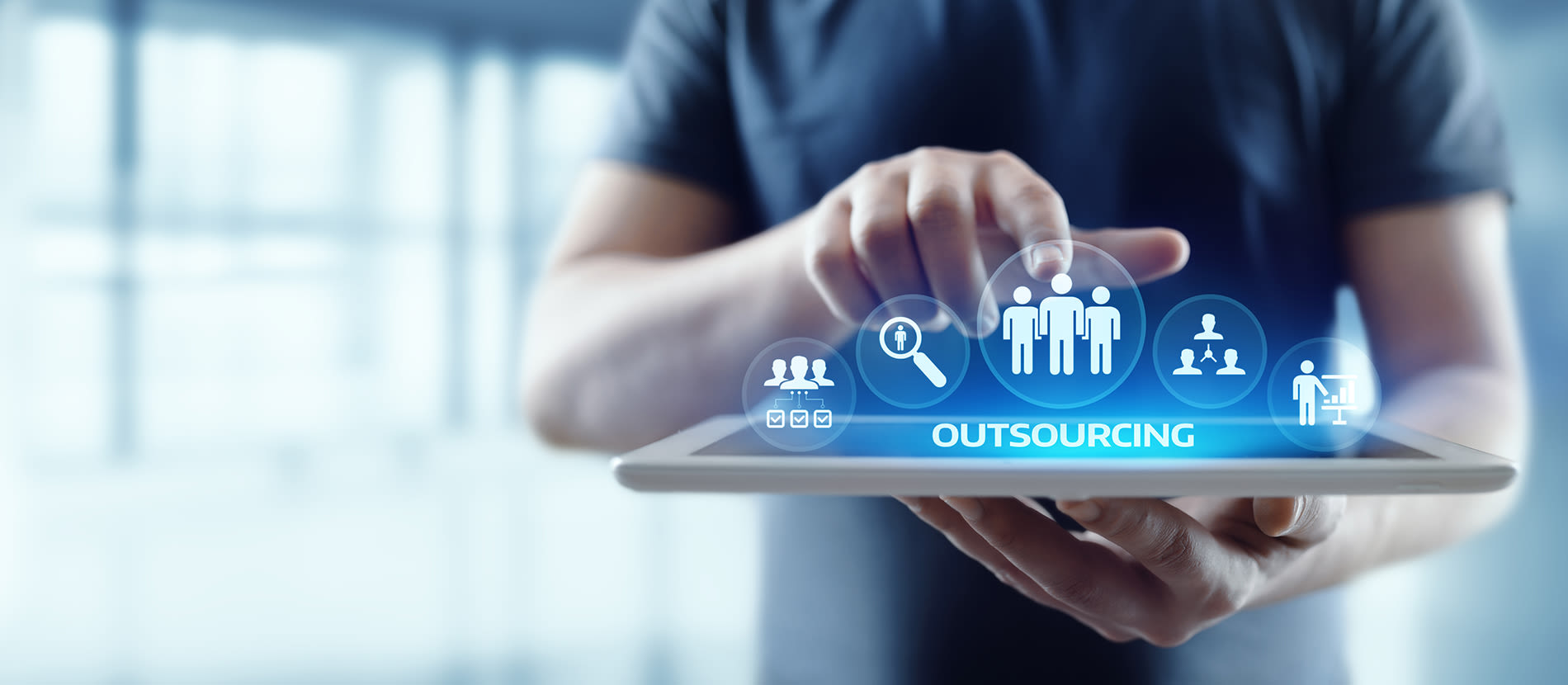 Person using an iPad to outsource financial management