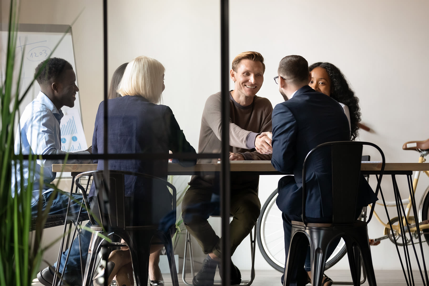 a group of professionals sitting together and discussing something