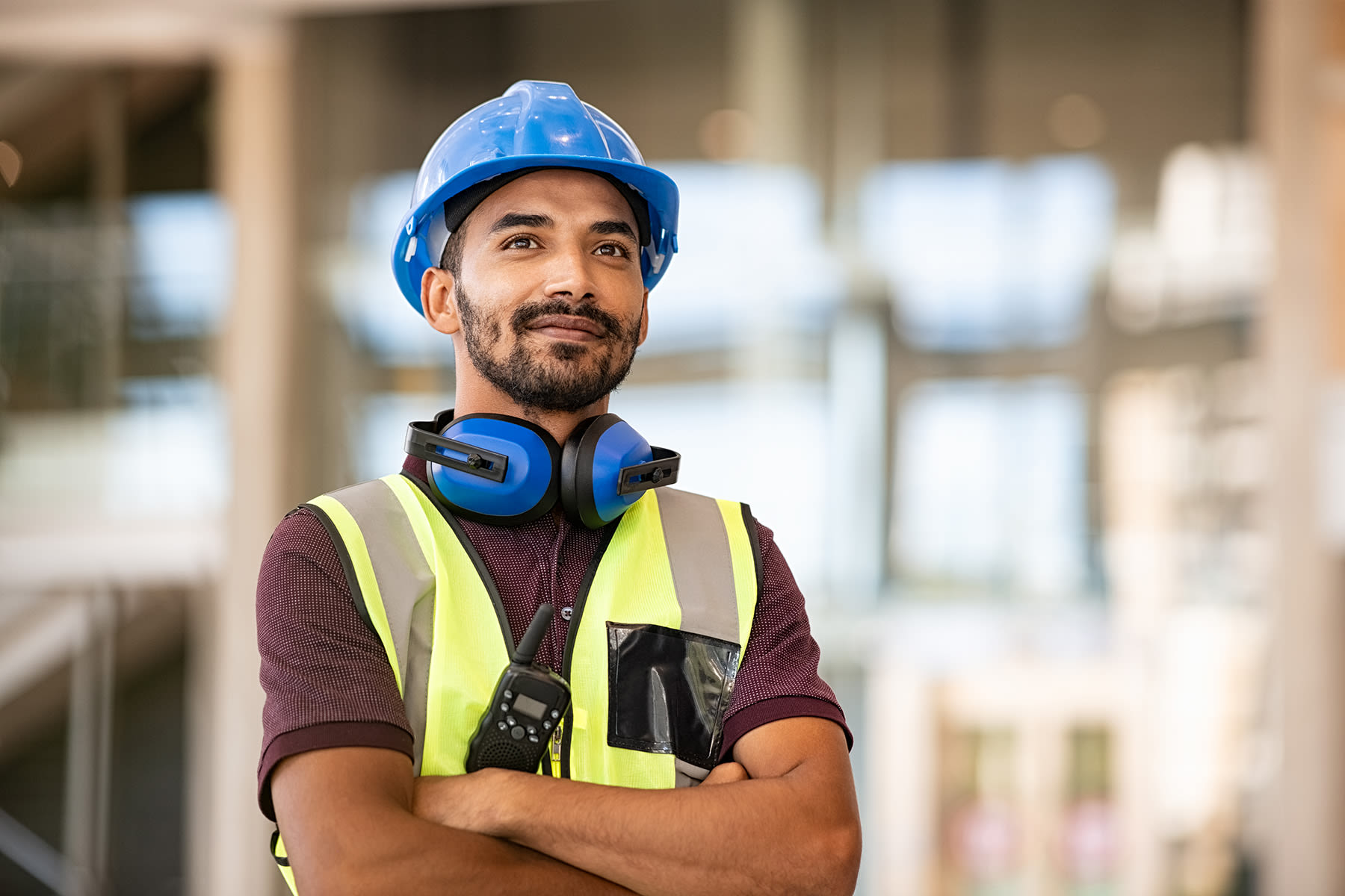 Construction worker wearing a vest and hard hat