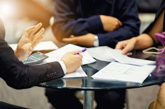 group of business people discussing at a table