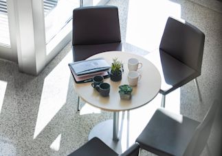 a business lobby showing a table that has documents on it