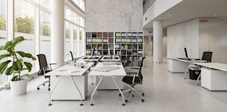 a large white room with a desk in the middle