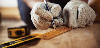 a person using a ruler to measure something