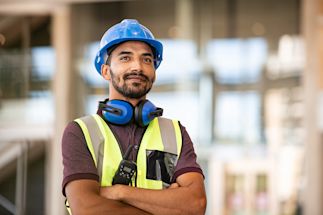 Construction worker wearing a vest and hard hat