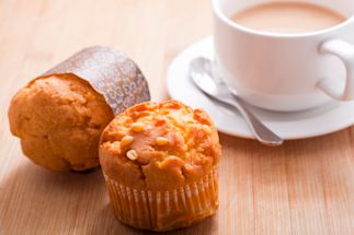 two muffins and a coffee on a table
