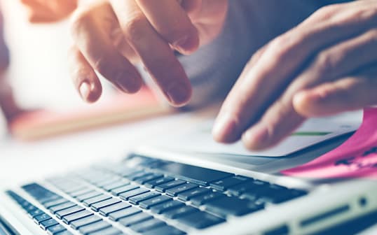 a person typing on a computer