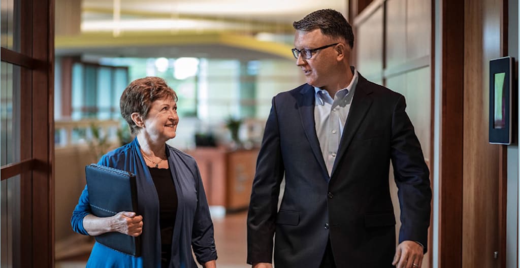 Jan Eddy and Brendan Freeman walking