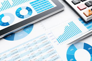 graphs on paper and a tablet